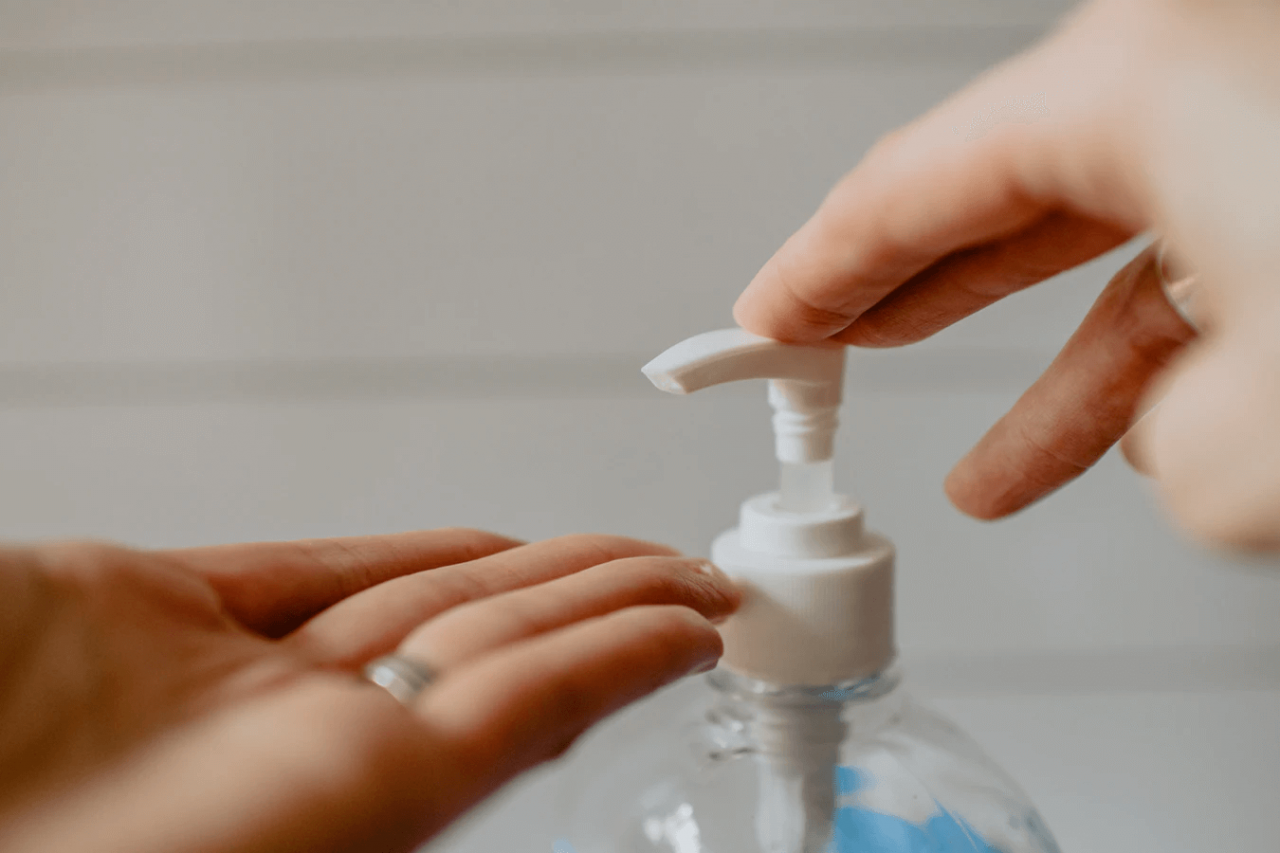 Person applying hand sanitizer 