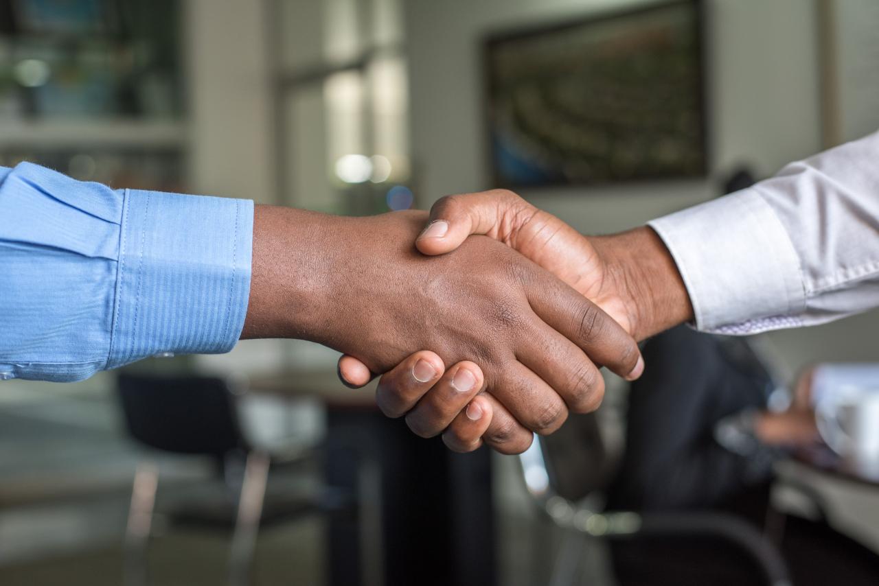 Shaking hands after making a deal on an existing laundromat